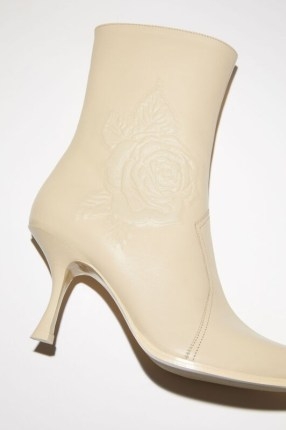 Acne Studios HEEL ANKLE BOOTS in Cream beige ~ womens floral motif leather boot ~ women’s luxury rose embossed booties - flipped