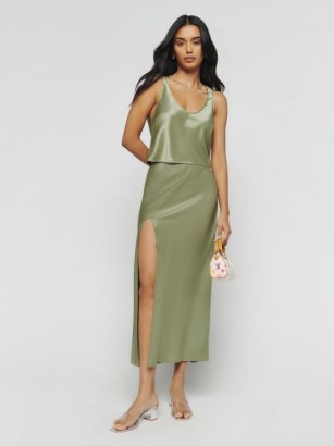 Reformation Kaia Two Piece in Artichoke / green satin fashion co-ord / luxury clothing sets / women’s silky co-ords / luxe tank top and bias cut midi skirt / matching slinky tops and skirts / thigh high slit - flipped