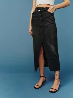 Reformation Nila Long Denim Skirt in Nome | women’s black front slit raw edge pencil skirts | frayed hemline | asymmetric closure | crossover waist