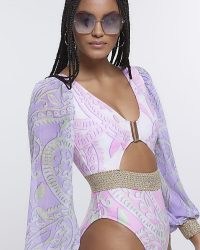 RIVER ISLAND PURPLE PRINTED PLUNGE CUT OUT SWIMSUIT – women’s balloon sleeve cutout swimsuits