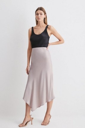 KAREN MILLEN Satin Asymmetric Slip Midi Skirt in Stone ~ women’s silky dip hem skirts ~ womens luxe style clothing - flipped