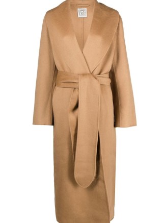 Selena Gomez’ longline oversized camel coat, TOTEME Robe belted wool coat. Worn with chunky black ankle boots. out in New York, March 2023 | celebrity street style | light brown tie waist coats | what celebrities wear