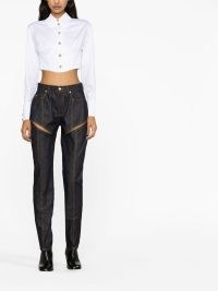 Alexander McQueen cutout high-rise tapered jeans in navy blue – women’s designer denim clothes – womens cut out detail clothing