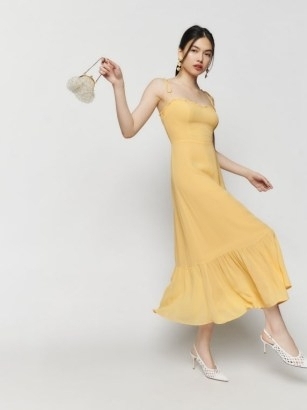 Reformation Enya Dress in Sunshine – yellow strappy sweetheart neckline midi dresses – tie shoulder strap fashion – tiered hem – luxe occasion fashion – summer event clothing – women’s wedding guest clothes