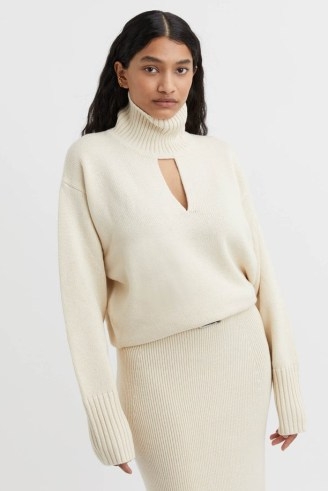 CAMILLA AND MARC Kalina Knit Cutout Turtleneck in Cream.| women’s high neck keyhole cut out sweater | womens luxury knitwear | front cutout jumpers | luxe thumb hole sweaters
