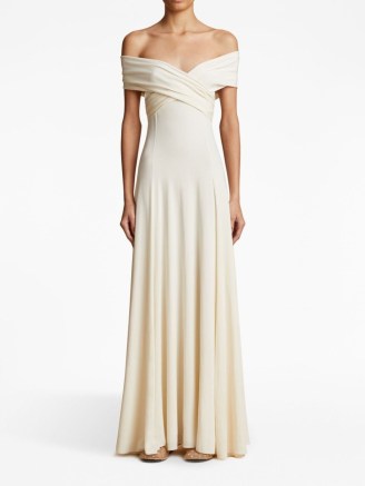 KHAITE The Bruna off-shoulder maxi dress in neutral – long length bardo dresses – women’s luxury occasion clothing