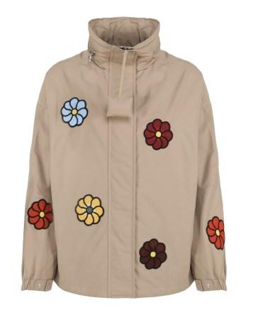 Zoe Saldana’s beige floral windbreaker coat, Moncler Genius X Jw Anderson Nylon Jacket with multicoloured flowers. Worn with white high waist cargo style jeans with side pockets, and brown leather block heel split toe shoes. Out in Paris, April 2023 | casual celebrity street style | unisex jackets | Zoe Saldana outfits - flipped