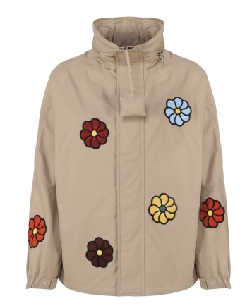 Zoe Saldana’s beige floral windbreaker coat, Moncler Genius X Jw Anderson Nylon Jacket with multicoloured flowers. Worn with white high waist cargo style jeans with side pockets, and brown leather block heel split toe shoes. Out in Paris, April 2023 | casual celebrity street style | unisex jackets | Zoe Saldana outfits
