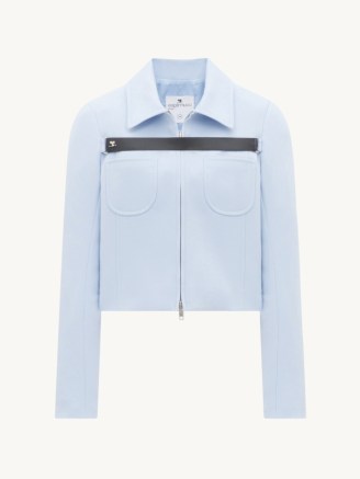 Jennie Kim’s light blue collared front zip jacket, Courrèges Twill Strap Jacket in Sky. Worn with a ruched white cotton skirt, ankle socks and panelled trainers. Departing for the USA, at IncheonAirport, South Korea, 2nd April 2023 | celebrity travel style | Jennie Kim outfits | BLACKPINK style - flipped