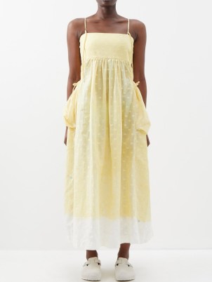 STORY MFG. Bay polka-dot organic-cotton midi dress / yellow strappy spot print summer dresses / womens skinny shoulder strap clothes / womens clothing with an oversized back bow