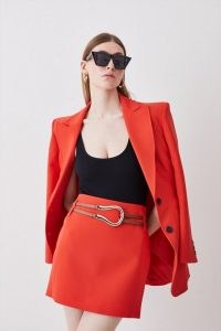 Karen Millen Clean Tailored Buckle Detail Mini Skirt in Red Orange | women’s short buckled skirts | womens recycled fabric clothes | sustainable clothing