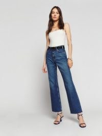 Reformation Hill Mid Rise Kick Flare Jeans in Araceli – women’s blue denim clothes – mid rise – reaxed fit with straight leg