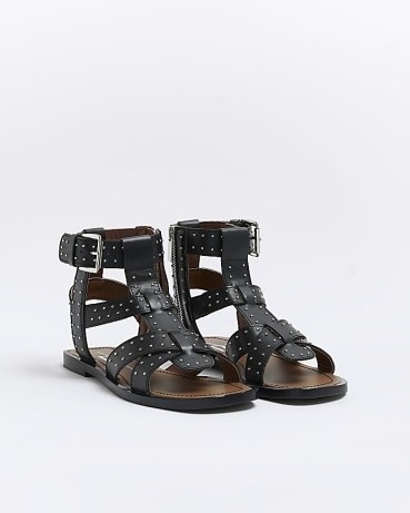 River Island BLACK STUDDED GLADIATOR SANDALS | women’s stud covered gladiators | strappy caged summer sandal | holiday flats - flipped