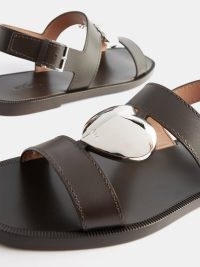 ALAÏA Metal-heart leather sandals | women’s dark brown slingback flats | strappy flat slingbacks