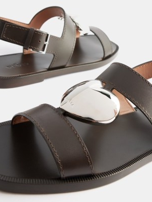ALAÏA Metal-heart leather sandals | women’s dark brown slingback flats | strappy flat slingbacks
