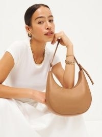 Reformation Medium Rosetta Shoulder Bag in Canyon | curved brown leather bags