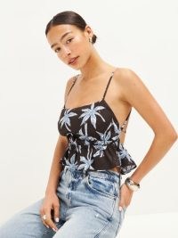 Reformation Pollie Linen Top in Date Palm / cute strappy peplum hem crop tops / spaghetti straps with a fit and flare design / tie back detail fashion / tree prints