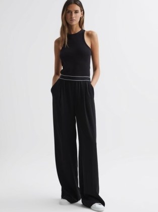 REISS ABIGAIL WIDE LEG ELASTICATED TROUSERS in BLACK / women’s chic casual relaxed fit clothing - flipped