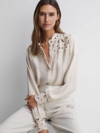 REISS CELIA LACE CUT-OUT BLOUSE in IVORY – feminine cutout detail blouses – relaxed fit blouson sleeve tops