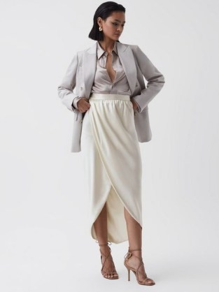 Reiss TYRA SILK HIGH-LOW WRAP SKIRT in Ivory – luxe silky occasion skirts – high low hem – asymmetric hemline – luxury occasionwear – women’s drapey event clothes - flipped
