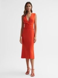 Reiss JAYLA FITTED WRAP DESIGN MIDI DRESS in ORANGE – vibrant sleeveless plunge front dresses – bright occasion clothes with plunging neckline