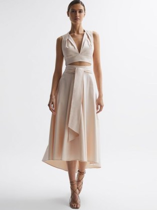 Reiss REBECCA FITTED HIGH RISE MIDI SKIRT in Nude – feminine summer occasion clothes – pale pink tie waist asymmetric hemline skirts – drapey event fashion