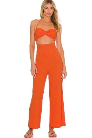 x REVOLVE Boat Linen Jumpsuit in Tangerine / orange front cut out halterneck jumpsuits / vibrant all-in-one summer fashion / cutout holiday clothes / strappy halter neck clothing