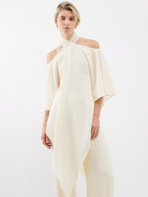 TALLER MARMO Sade off-the-shoulder pointed-hem crepe top ~ fluid ivory asymmetric hemline tops ~ chic asymmetrical occasion clothes