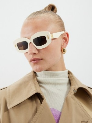LOEWE EYEWEAR Screen acetate sunglasses | women’s chunky retro sunnies | vintage style eyewear | brown tinted lenses | thick ivory frames - flipped
