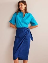 Boden Wrap-Front Linen Midi Skirt in Sapphire / women’s chic blue summer skirts / side tie detail