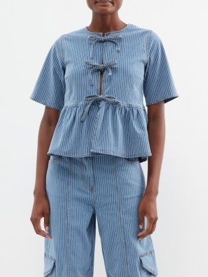 GANNI Striped organic cotton-blend denim blouse ~ blue stripe peplum tops ~ tie front blouses with a tiered hem
