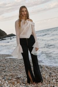 Aje. Edith Draped Top in Champagne Cream ~ asymmetrical semi sheer tops ~ luxe oversized fluted cuff blouse ~ contemporary fashion ~ feminine asymmetric one shoulder blouses