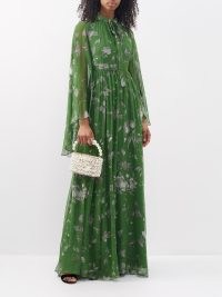ERDEM Tie-neck floral-print silk gown in green – flowing sheer overlay cape gowns – romantic occasion maxi dresses – floaty and feminine long drop sleeve event dress