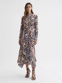 REISS LIRA ANIMAL PRINT BELTED MIDI DRESS in NUDE / BLACK – chic long sleeve high neck asymmetrical hemline dresses – sophisticated occasion clothing – asymmetric detail evening clothes