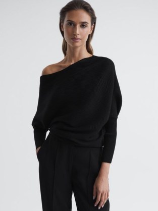Reiss LORNA ASYMMETRIC DRAPE KNITTED TOP in BLACK | women’s tops with an asymmetrical neckline | chic knitwear clothing