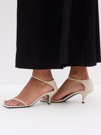 TOTEME The Strappy 55 leather sandals in off white – luxe barely there sandal