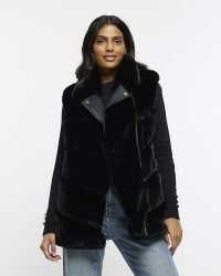 RIVER ISLAND BLACK FAUX FUR BIKER GILET – fluffy high neck gilets – women’s sleeveless winter jackets