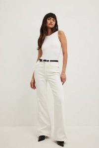 NA-KD Flared High Waist Jeans in White | women’s summer denim clothing | casual flares