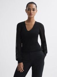 REISS BROOKLYN SHEER SLEEVE V-NECK TOP in BLACK – women’s tops with long drapey sleeves
