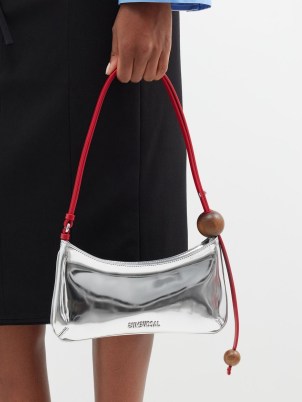 JACQUEMUS Bisou Perle small faux-leather shoulder bag in silver / metallic baguette style bags / shiny 90s inspired handbag / luxe mini handbags - flipped