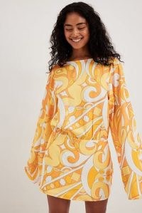 Camille Botten x NA-KD Wide Sleeve Open Back Dress in Muliticolour | fashion with Pucci style prints | floaty sleeved vintage inspired mini dresses | reto print clothing