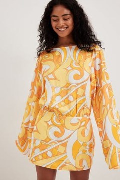 Camille Botten x NA-KD Wide Sleeve Open Back Dress in Muliticolour | fashion with Pucci style prints | floaty sleeved vintage inspired mini dresses | reto print clothing