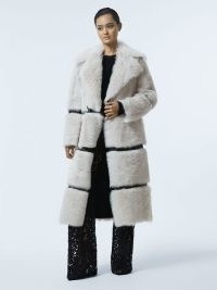 Reiss SLOANE ATELIER SHEARLING LEATHER TRIM LONG COAT PINK – women’s luxury fluffy winter coats – luxe outerwear