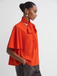 REISS FLORERE TIE NECK BLOUSE in Orange / vibrant wide sleeved blouses / chic clothing / bright fluid fabric angel sleeve tops / sophisticated looks