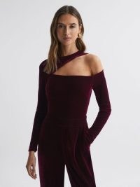 Reiss ADELE VELVET FITTED CUT-OUT JUMPSUIT BERRY – plush jewel tone jumpsuits – sophisticated evening clothing – luxe party fashion