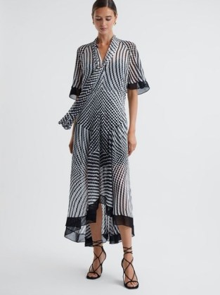REISS ANAYA CHECK REMOVABLE NECK TIE MIDI DRESS in BLACK / WHITE – flowing asymmetric dresses – monochrome print occasion clothing p