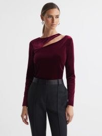 REISS MILA VELVET CUT-OUT TOP in BERRY – plush jewel tone long sleeve tops – chic winter evening fashion