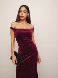 Reformation Ritz Knit Dress in Red Wine Velvet – jewel tone off the shoulder maxi dresses – luxury fitted evening event fashion – luxe bardot occasion clothing