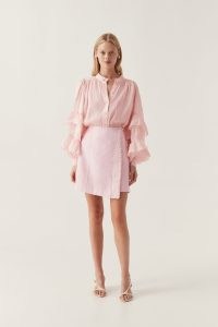 Aje Theory Cinched Mini Skirt in Soft Pink – asymmetric faux wrap skirts