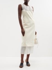 KHAITE Dissa layered satin and tulle midi dress in cream and white ~ sleeveless semi sheer dresses